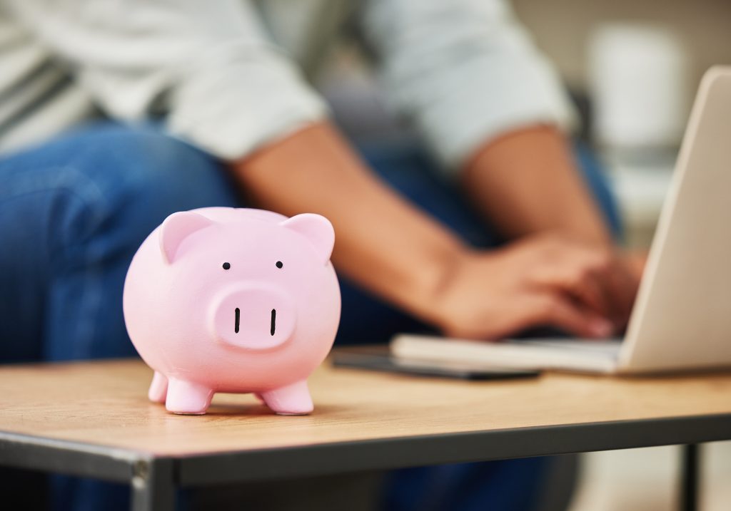 Always plan ahead. Shot of a piggy bank on a table in a house
